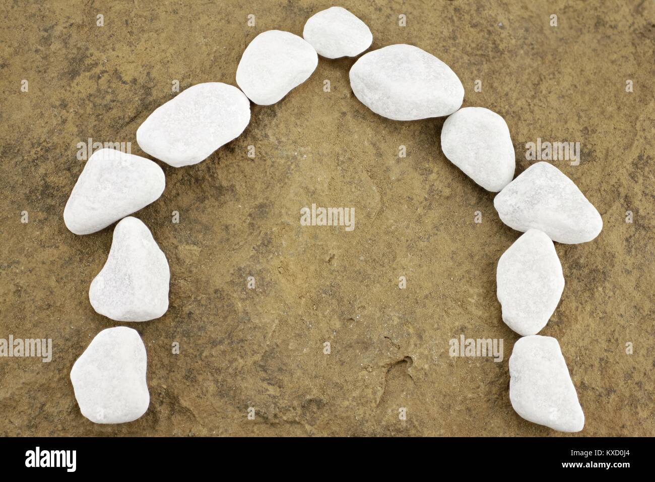 Symbolic house presented with white pebbles Stock Photo
