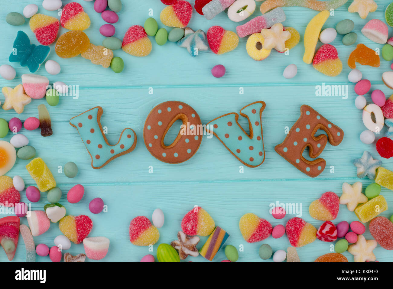 Colorful candies on wooden background. Stock Photo