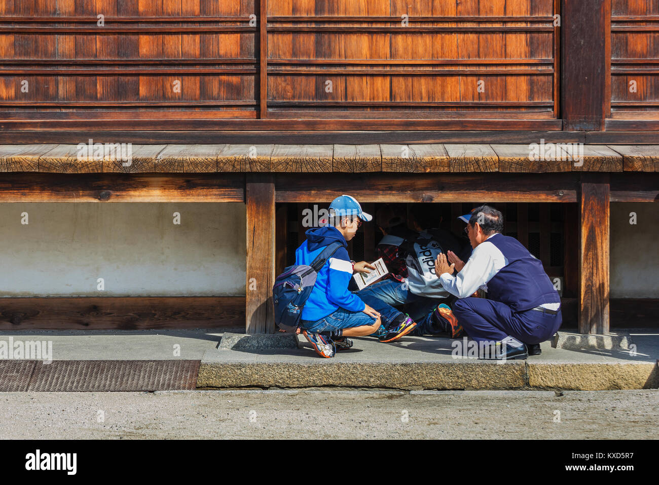 Nijo Castle in Kyoto, Japan  KYOTO, JAPAN - OCTOBER 23: Nijo Castle  in Kyoto, Japan on October 23, 2014. Unidentified group of Japanese students with Stock Photo