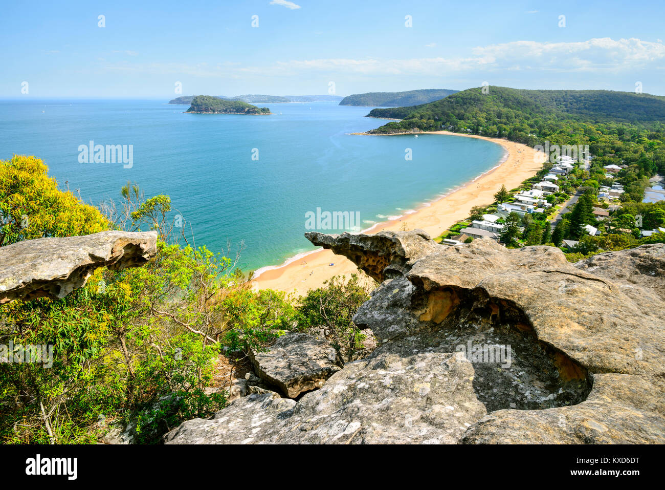 Pearl Beach on a sunny day with blue sky from Mount Ettalong Lookout, Central Coast, NSW, Australia Stock Photo