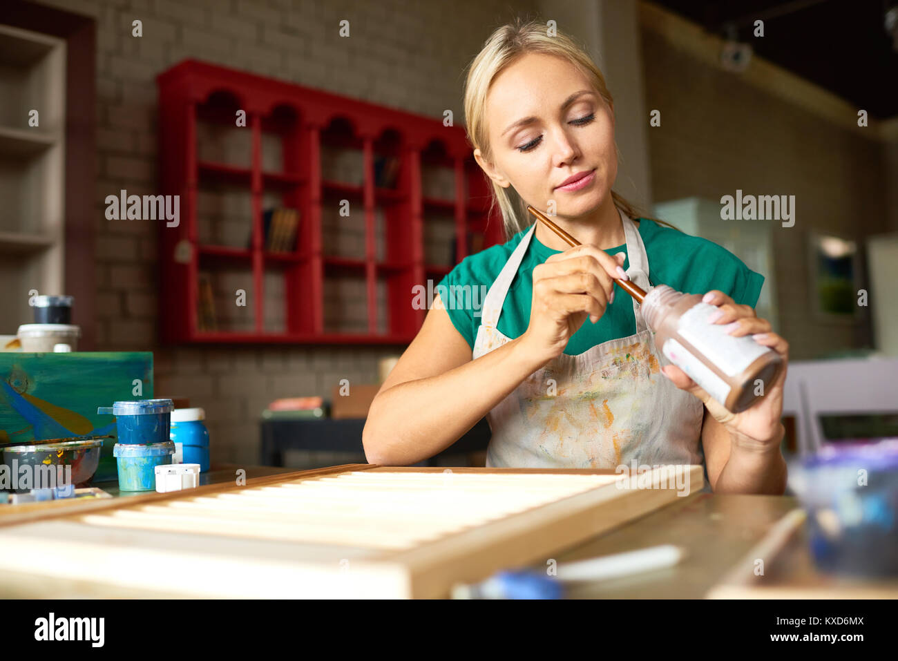 Pretty Young Woman Working in Art Studio Stock Photo - Alamy