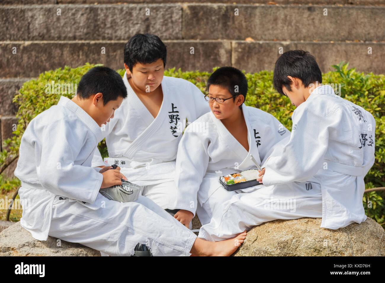 OSAKA, JAPAN - OCTOBER 25: Shudokan Hall in Osaka, Japan on October 25, 2014. Unidentified Japanese students have lunch while attending the Judo class Stock Photo
