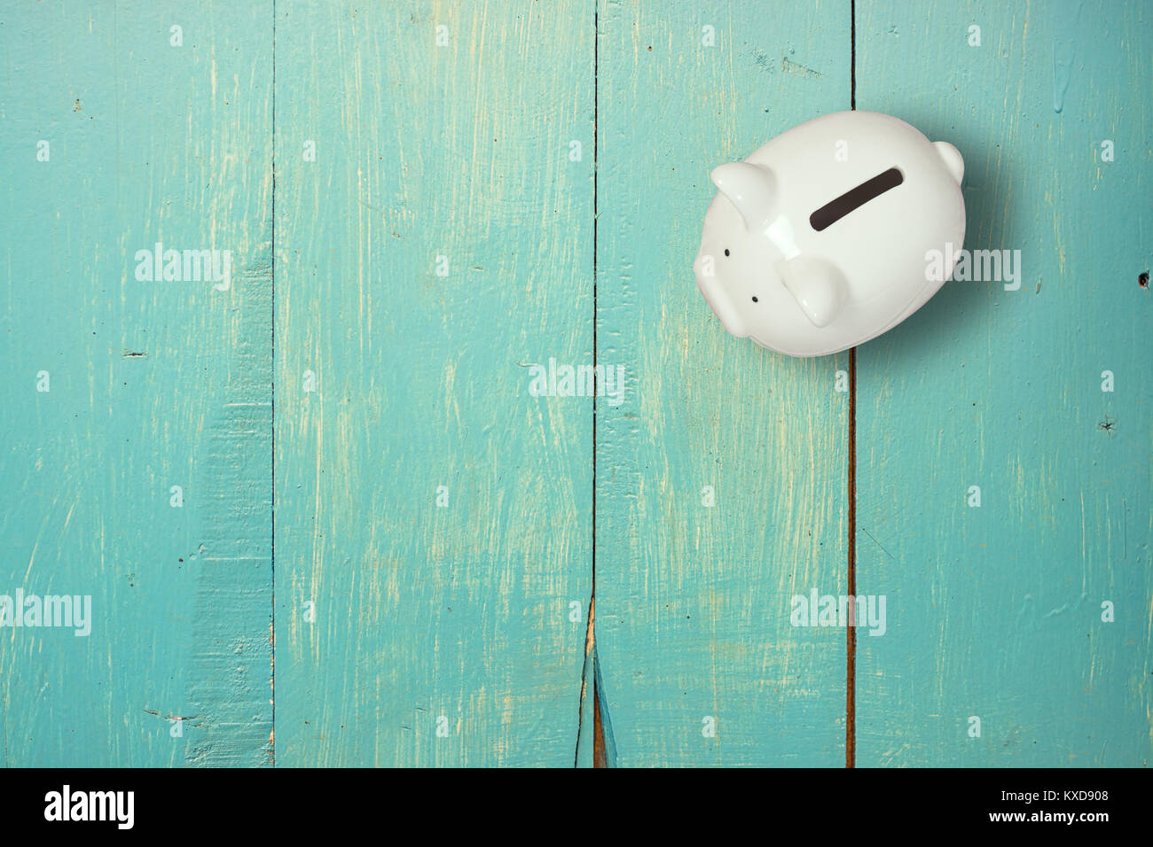 piggy bank save coin on wooden desk, copy space. Stock Photo