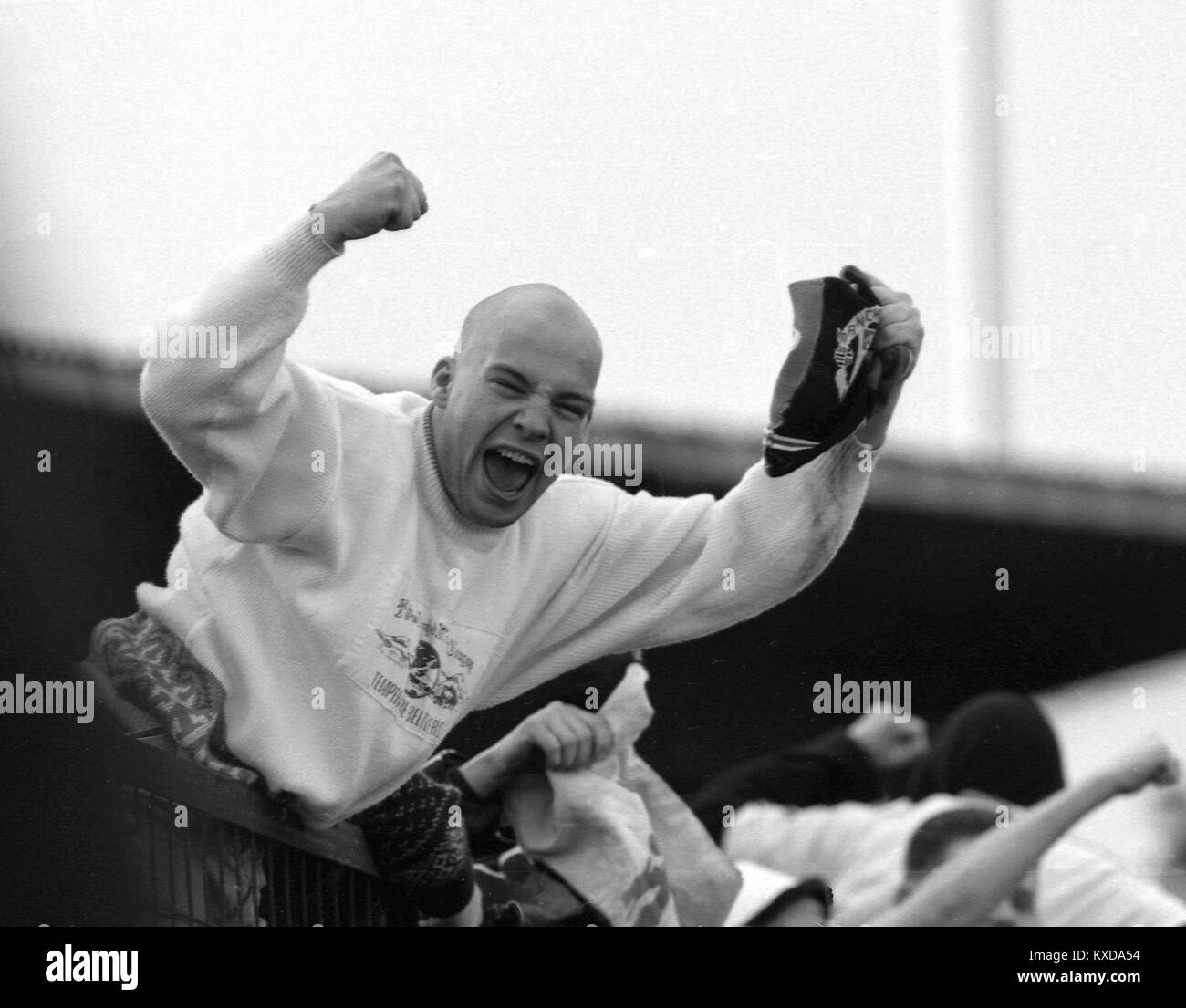 28 January 1990. Manchester United Fan celebrating during his team's win at Hereford United in the FA Cup 4th Round.  Photo by Tony Henshaw Stock Photo
