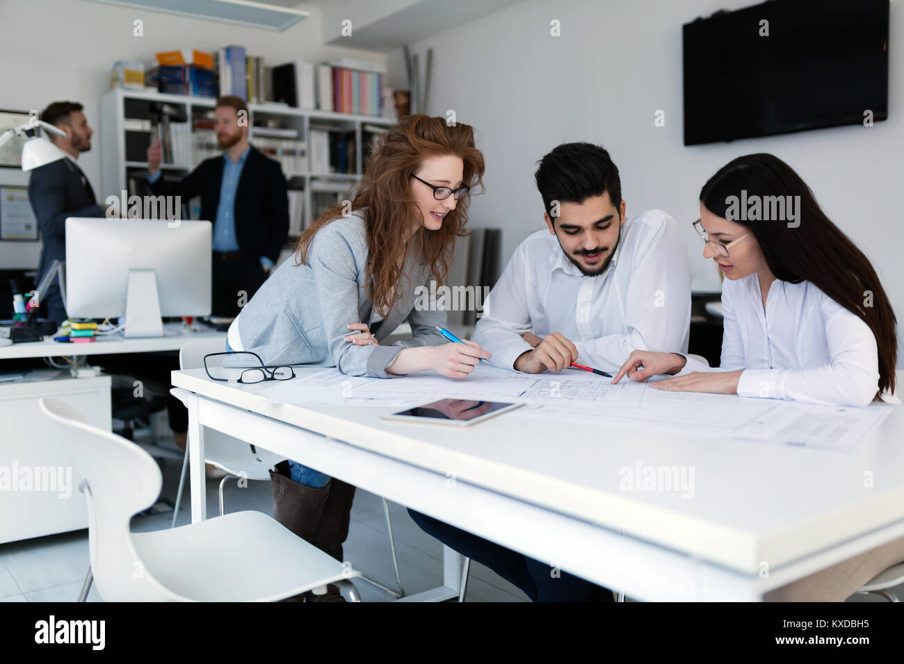 Group of architects working together on project Stock Photo