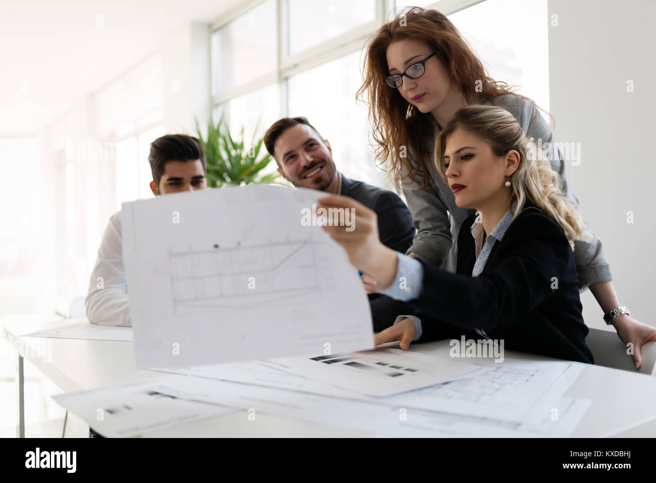 Group of architects working together on project Stock Photo