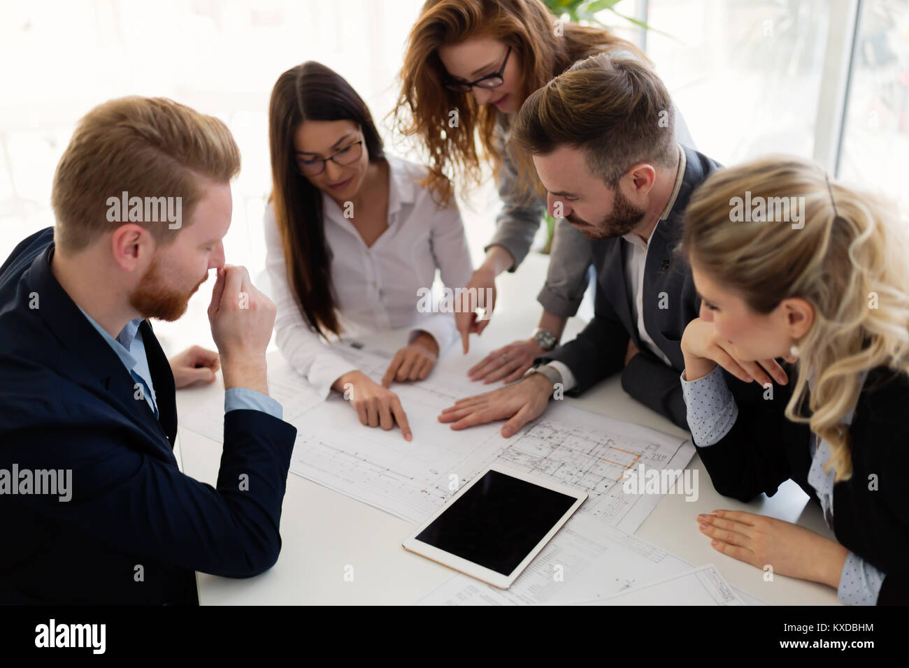 Group of architects working together on project Stock Photo