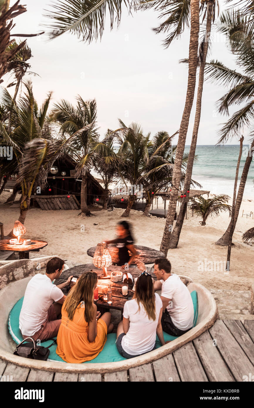 People enjoying beach at Papaya Playa Resort in Tulum, Mexico Stock Photo