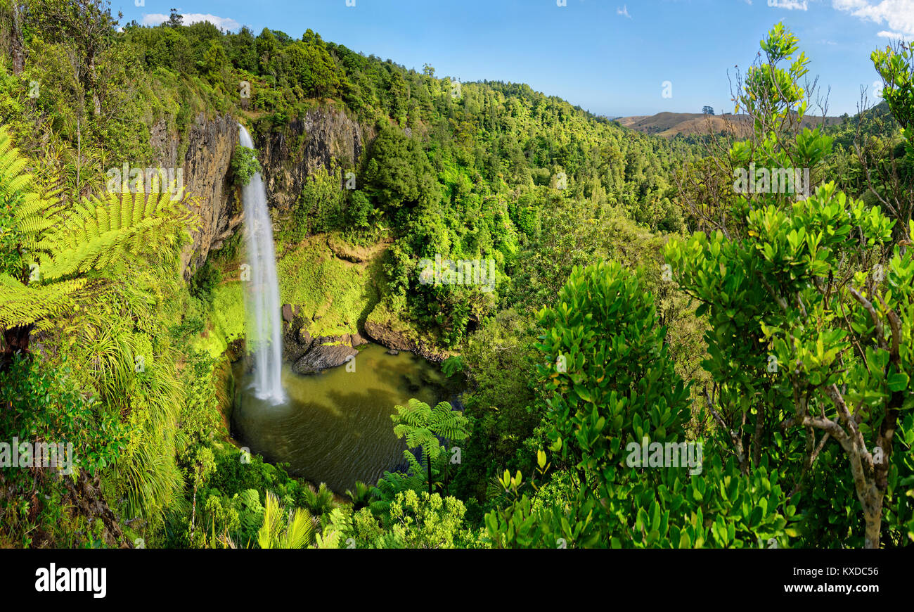 Wall of columnar basalt with waterfall Bridal Veil Falls,tropical ...