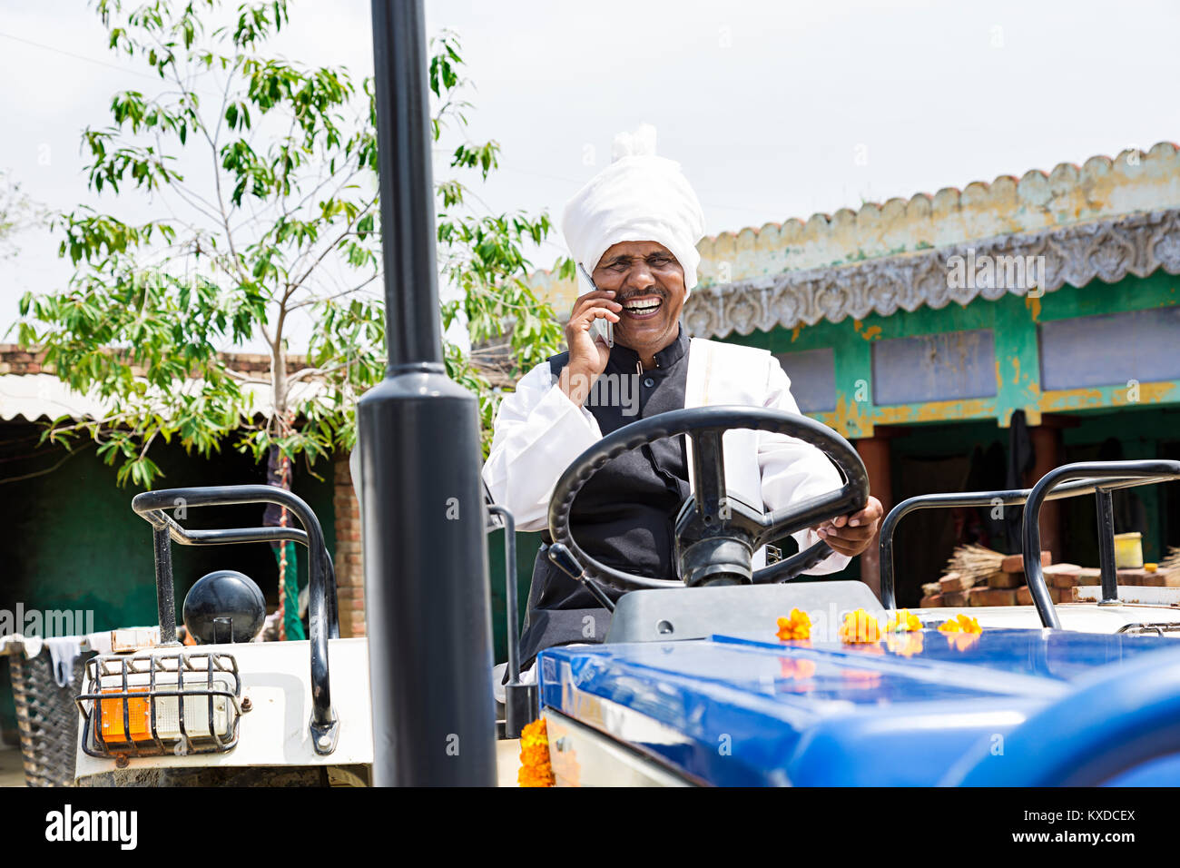 1 Indian Rural Farmer Man Driving tractor talking Cell phone Stock ...
