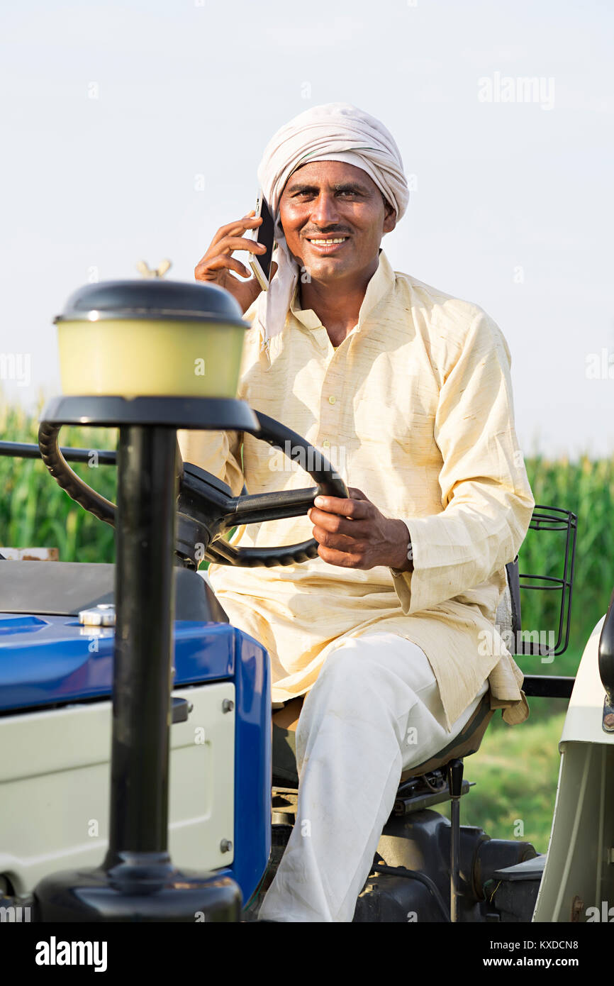 1 Indian Rural Farmer Driving Tractor Talking Cell Phone Farm Stock ...