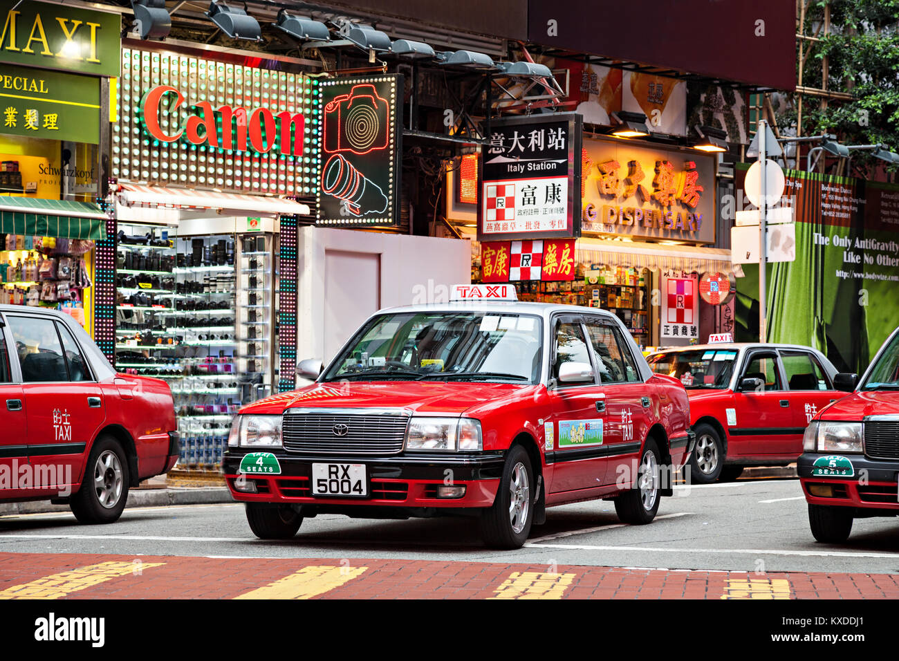 HONG KONG - MARCH 19: Taxis on the street on March 19, 2013 in Hong Kong. Over 90% daily travelers use public transport. Its the highest rank in the w Stock Photo