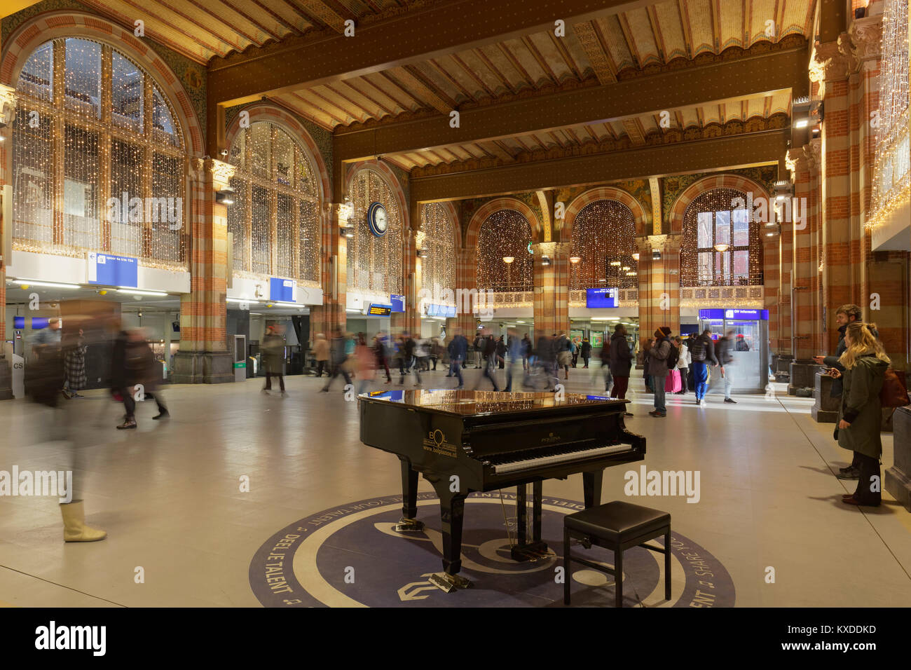 Piano for general use in the station concourse,Christmas decoration,Amsterdam  Centraal railway station,Amsterdam,Holland Stock Photo - Alamy