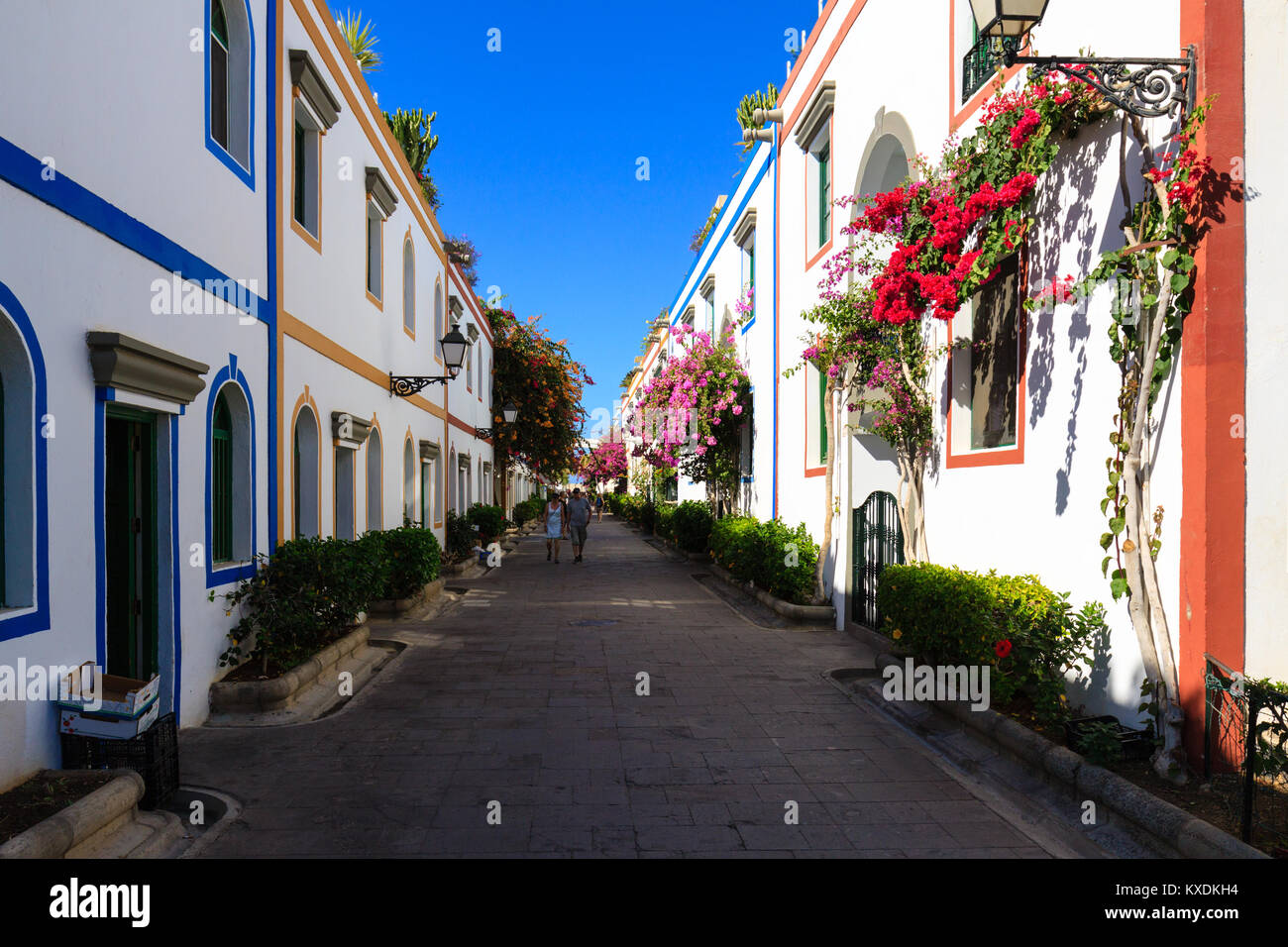 Wonderful alley with colorful flowers, doors and windows in Puerto De Mogan on Gran Canaria island. Stock Photo