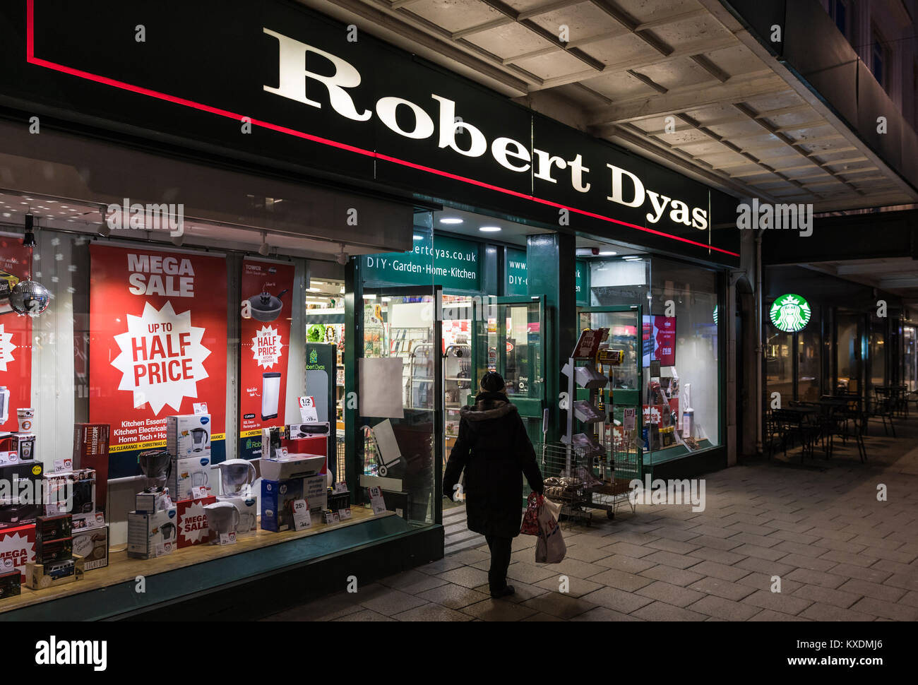 Robert Dyas shop front entrance open after dark in Worthing, West Sussex, England, UK. Retail store. Stock Photo