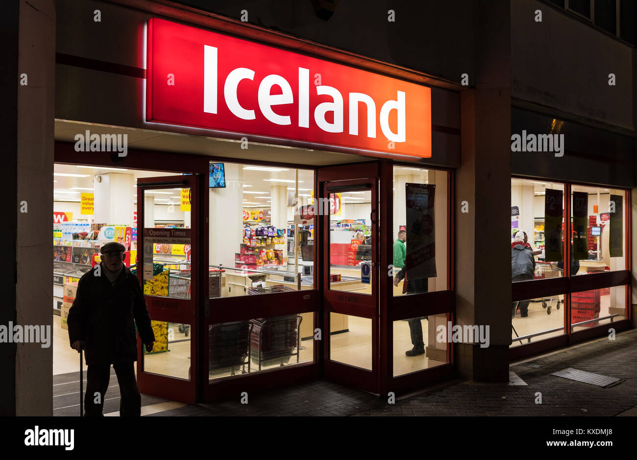 Iceland shop front entrance open after dark in Worthing, West Sussex, England, UK. Stock Photo