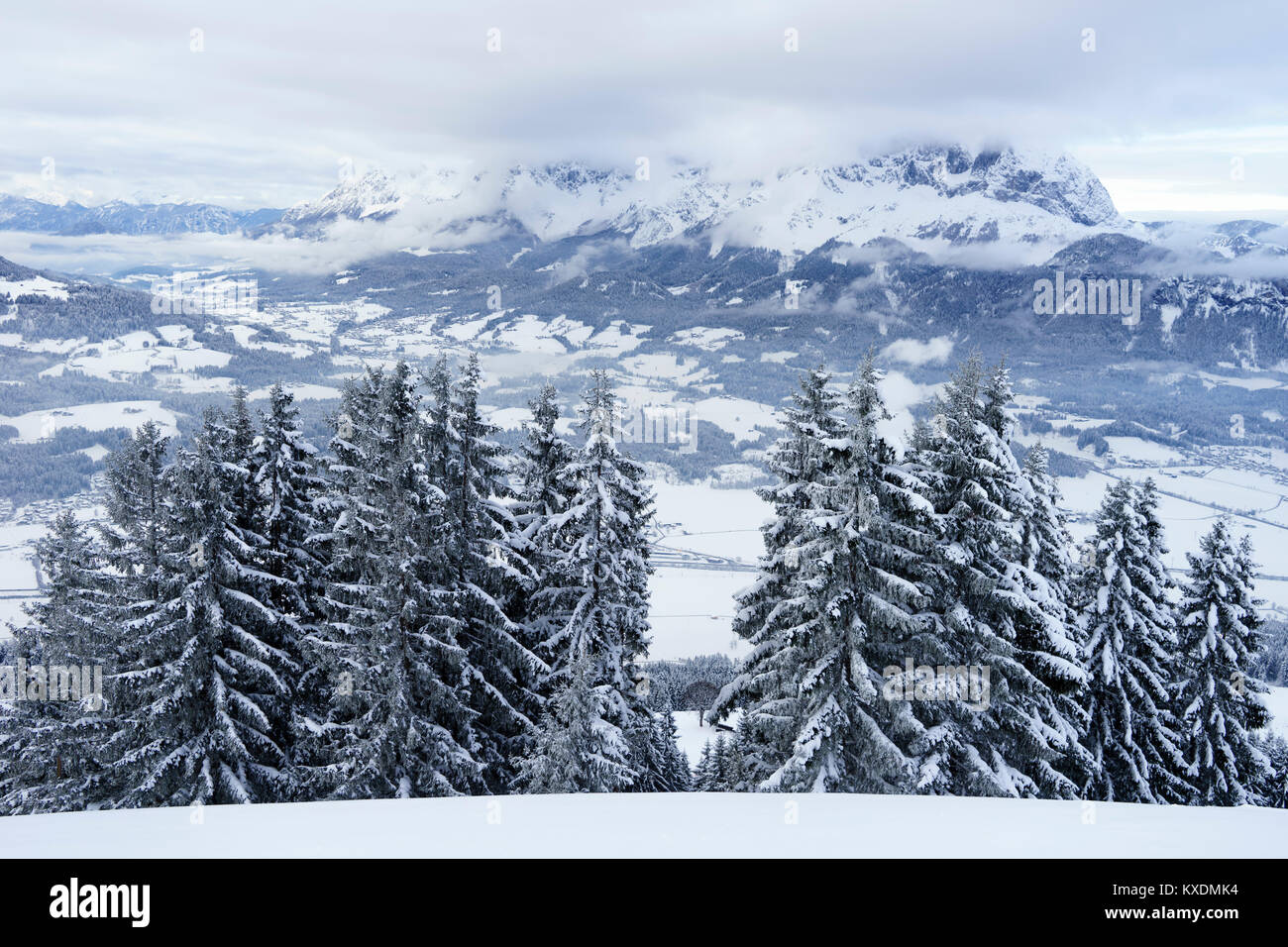 Wilder Kaiser in winter in the clouds, Kaisergebirge, Oberndorf St. Johann, Tyrol, Austria Stock Photo