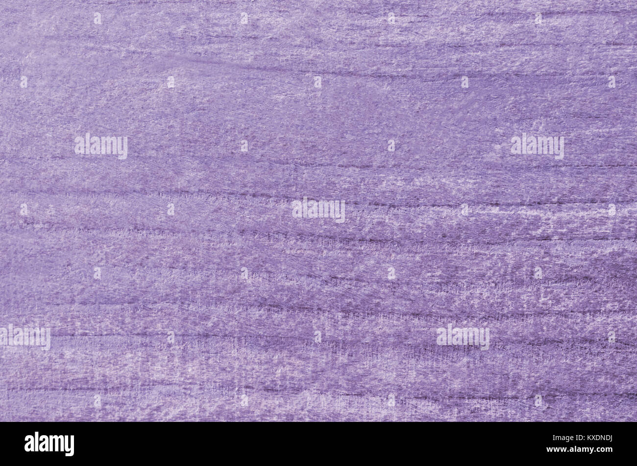 Organic natural wood background with curving striped grain in washed out faded purple or violet hue. Stock Photo
