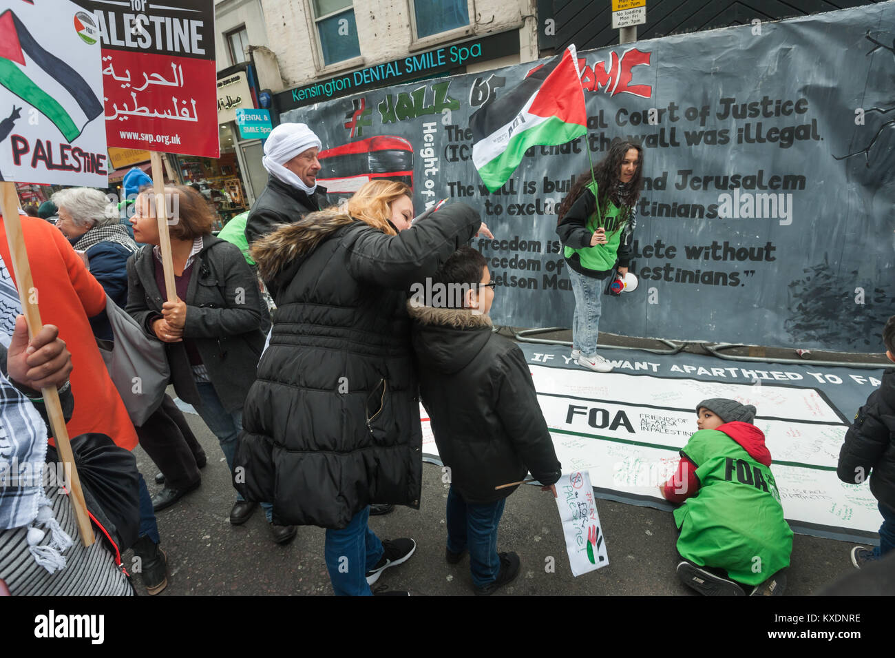 Friends of Al-Aqsa had a mock wall at the protest at Israeli embassy in London calling for Freedom for Palestine with the message that the International Court of Justice has said the Israel's apartheid wall is illegal. Stock Photo