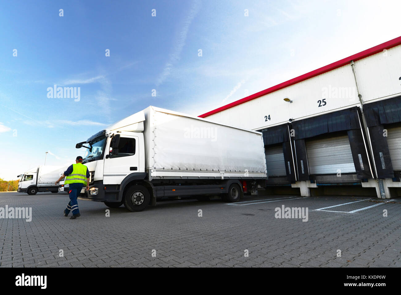 logistics and goods storage - loading and unloading of goods for transport by truck Stock Photo