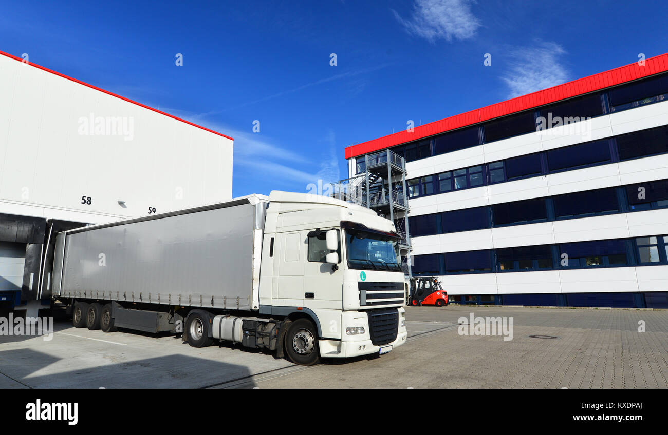 logistics and goods storage - loading and unloading of goods for transport by truck Stock Photo
