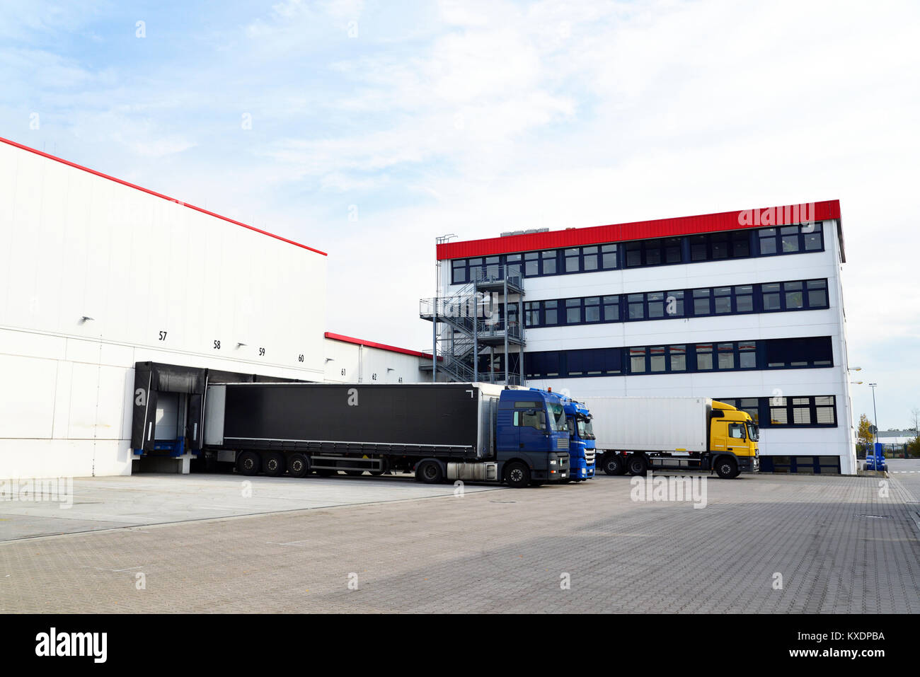trucks are loaded with goods at the depot in a shipping company Stock ...
