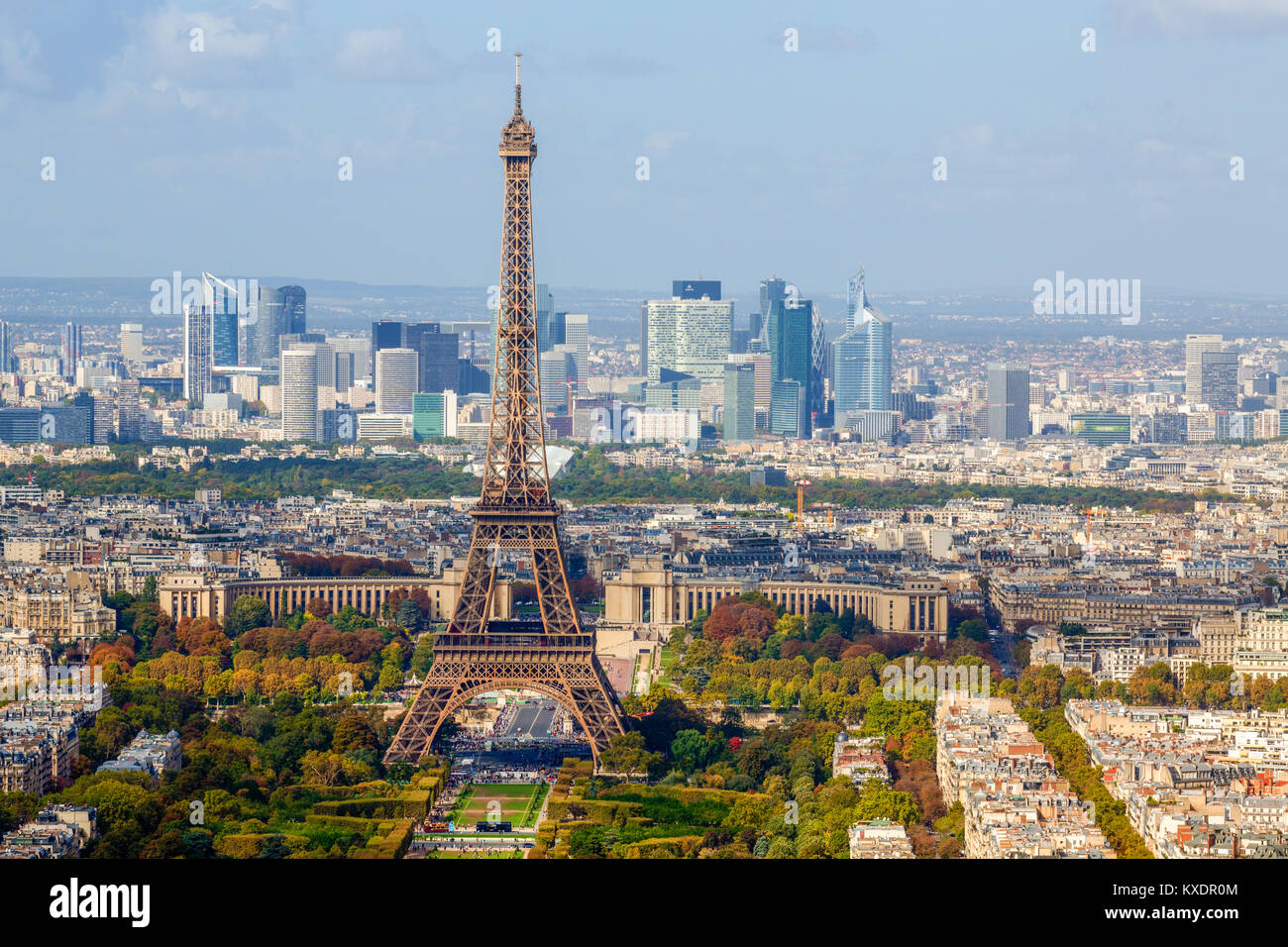 Eiffel tower in front of high-rise La Défense quarter, Paris, France Stock Photo