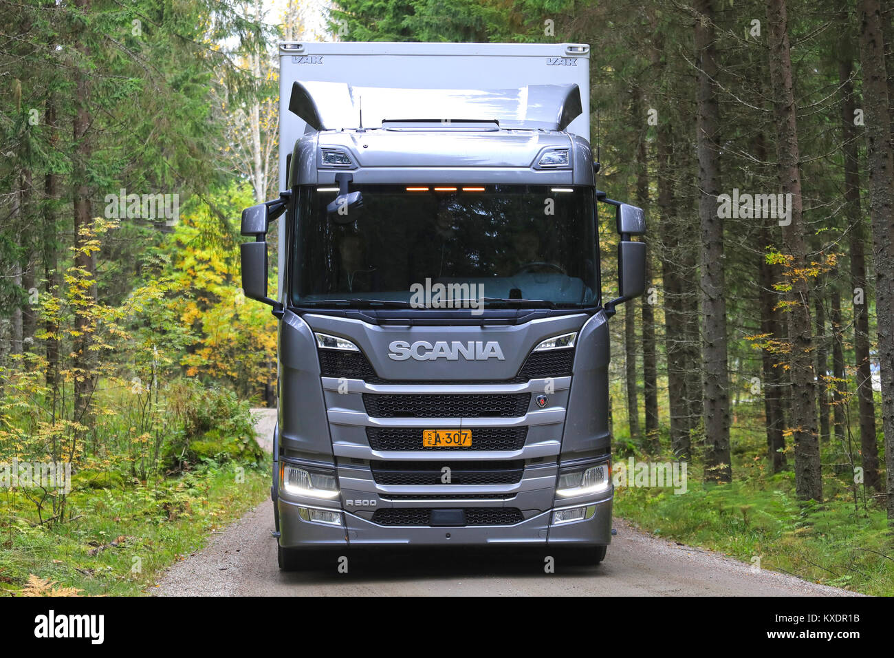 LAUKAA, FINLAND - SEPTEMBER 22, 2017: Silver Next Generation Scania R500 heavy truck up front on a small forest road for a test drive during Scania La Stock Photo