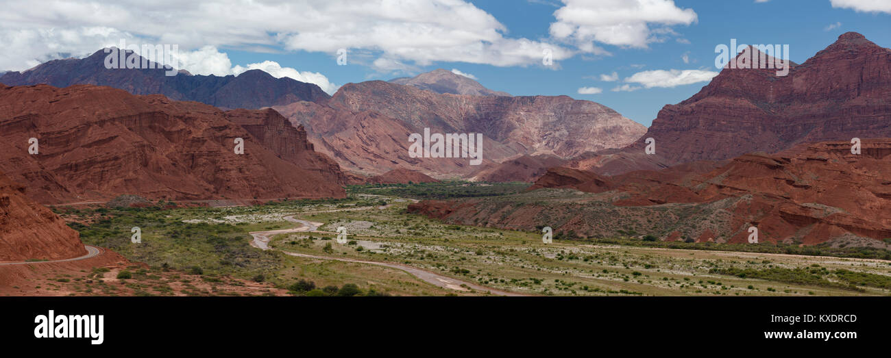 Green valley with river, red-coloured mountains, Departamento Guachipas, Province of Salta, Argentina Stock Photo
