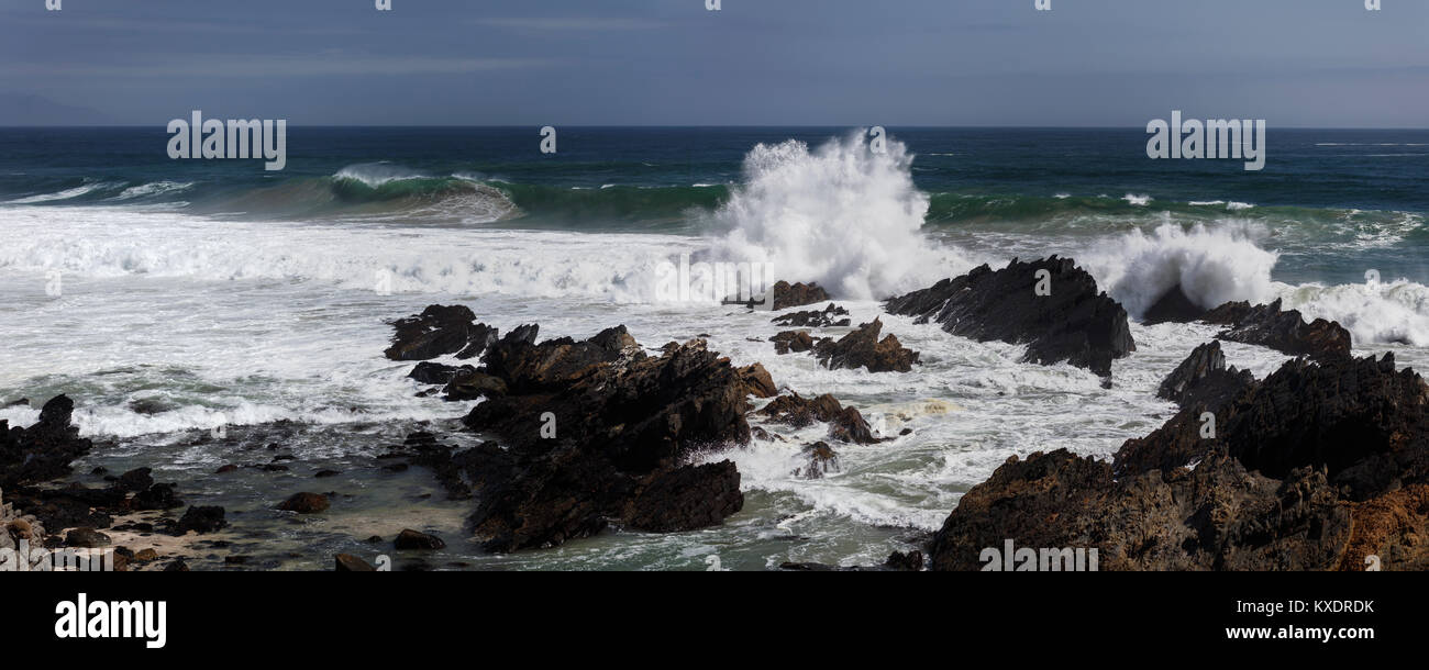 Breaking waves between rocks on the beach, Los Molles, La Ligua, Valparaíso, Chile Stock Photo