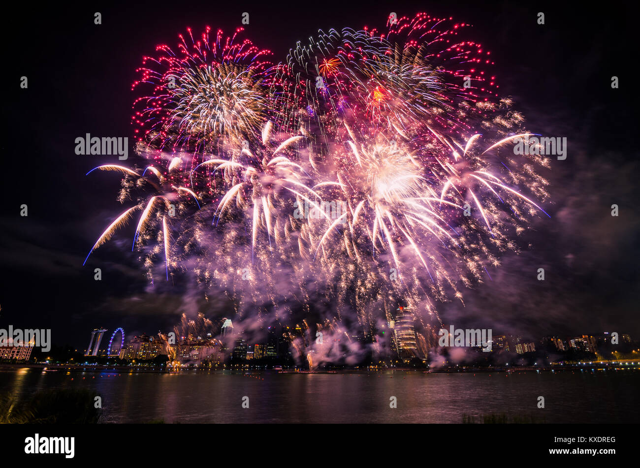 Firework display for Singapore National day which celebrated every year on August 9, in commemoration of the Singapore's independence in 1965. Stock Photo