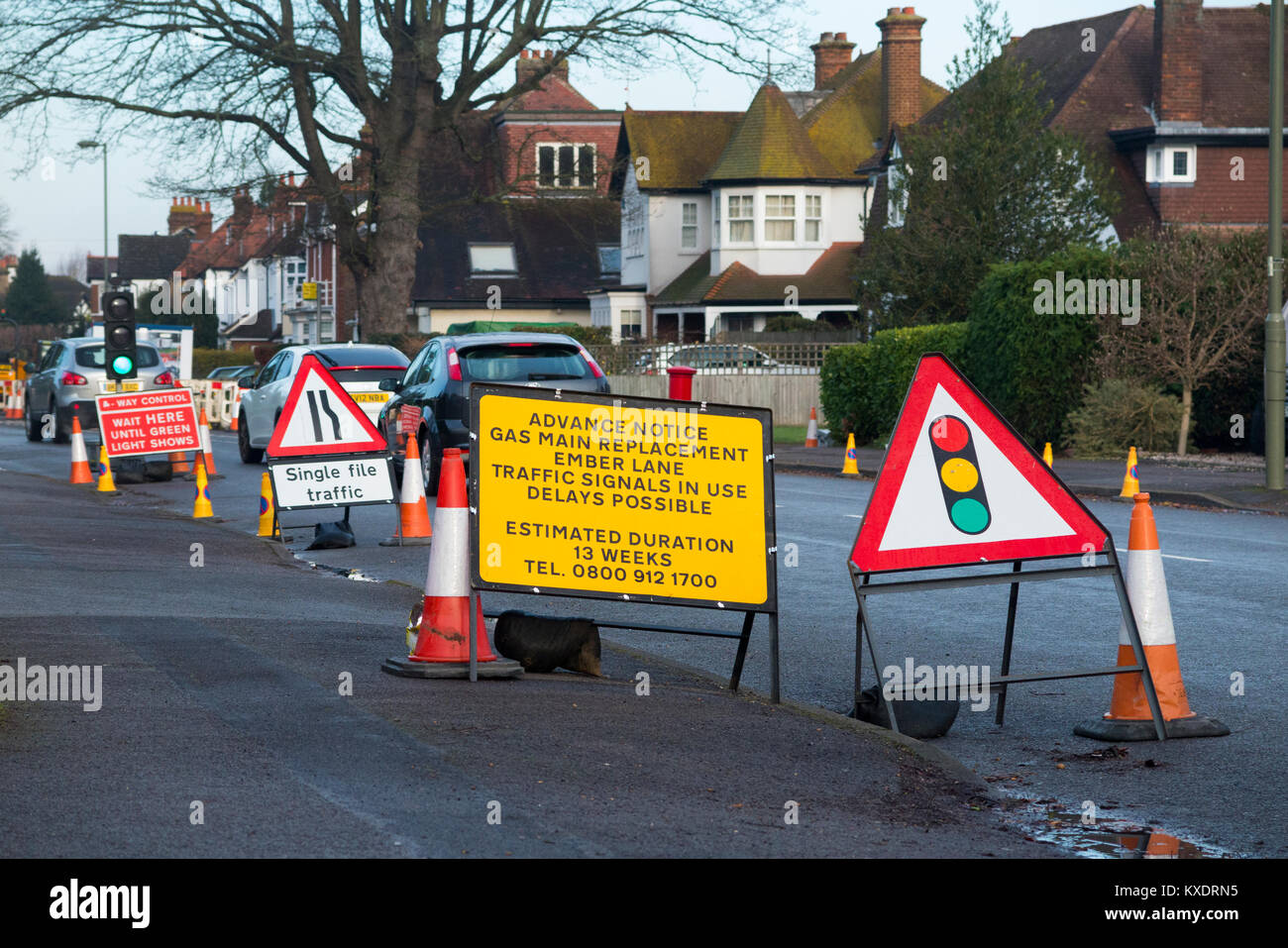 Temporary roadworks with traffic light signals and cones / sign / signs / traffic light. UK. (93) Stock Photo