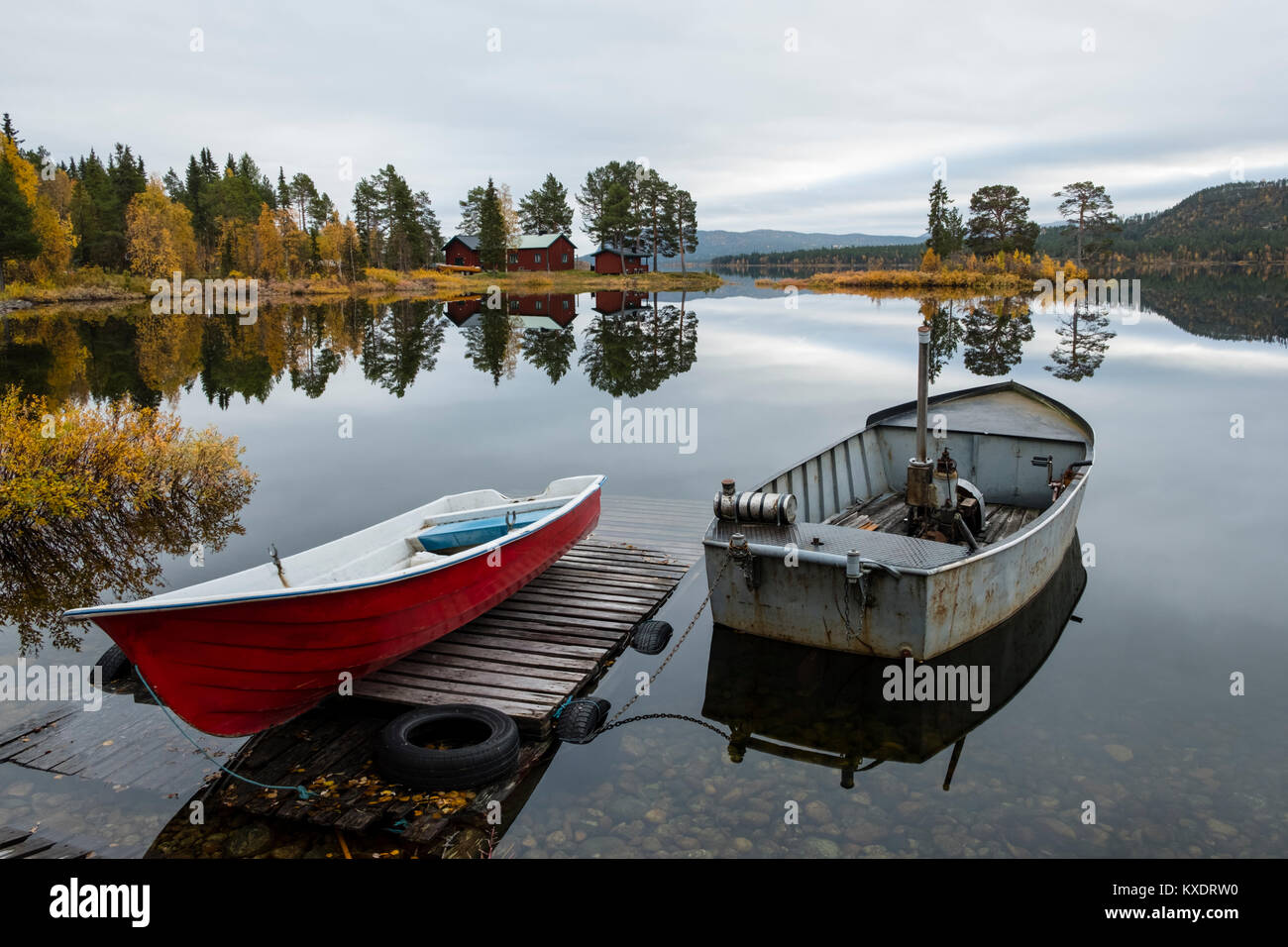 Boats at the lake, Autumnal landscape, Mirroring, Norrbottens, Norrbottens län, Laponia, Lapland, Sweden Stock Photo