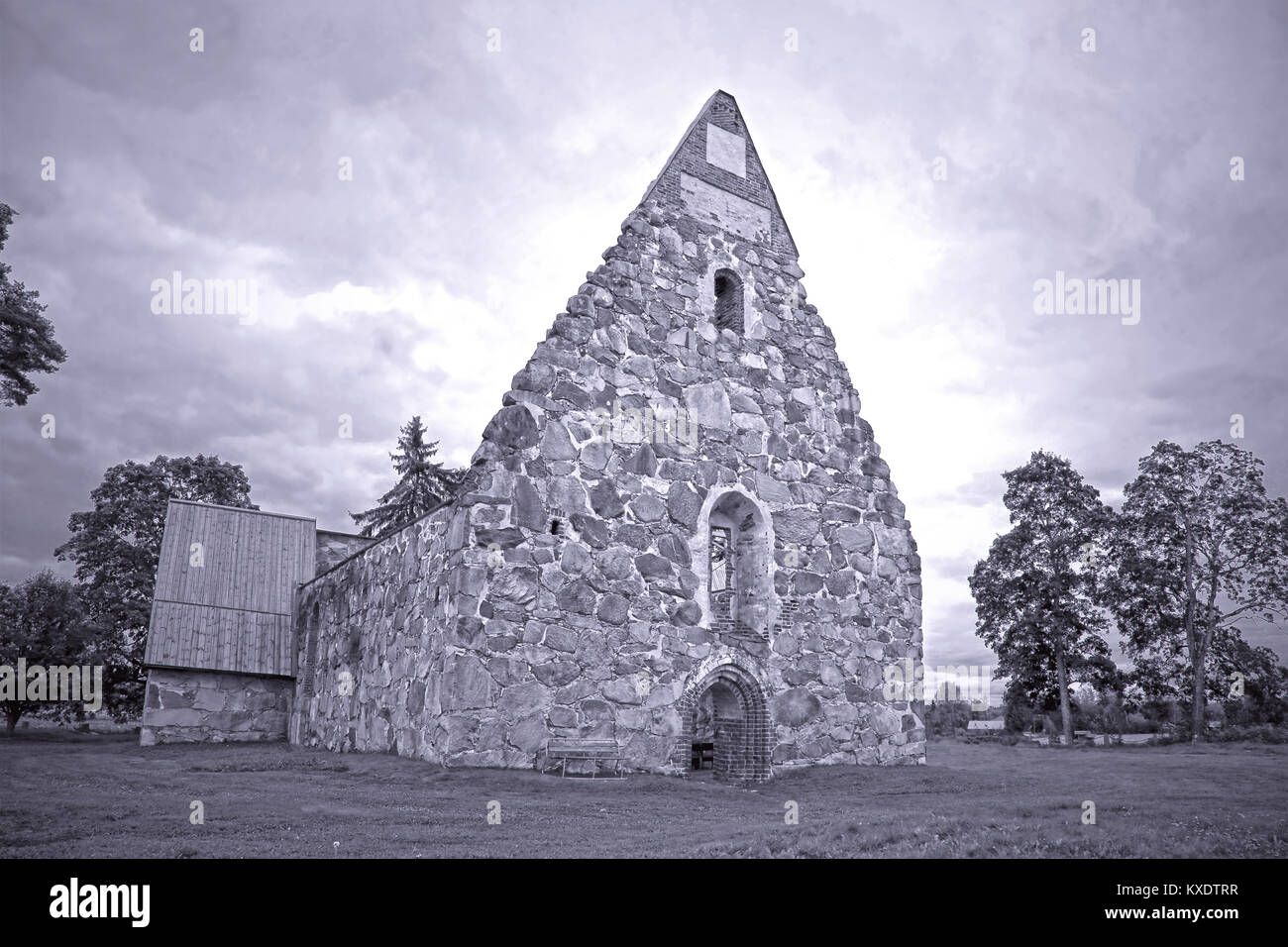 Ruin of old stone church on a cloudy day at summer in Palkane, Finland. Hdr enhanced, in black and white. Stock Photo