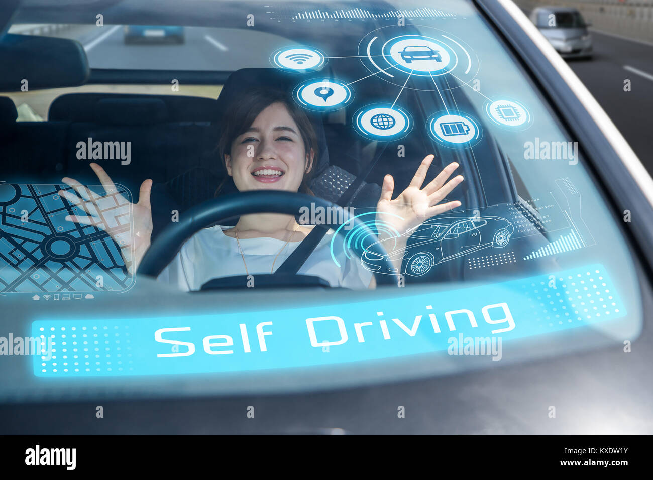 young woman riding the self driving car. autonomous car. Stock Photo