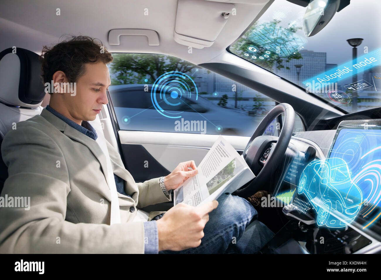 Caucasian driver reading magazine in autonomous car. Self driving vehicle. Driverless car. Stock Photo