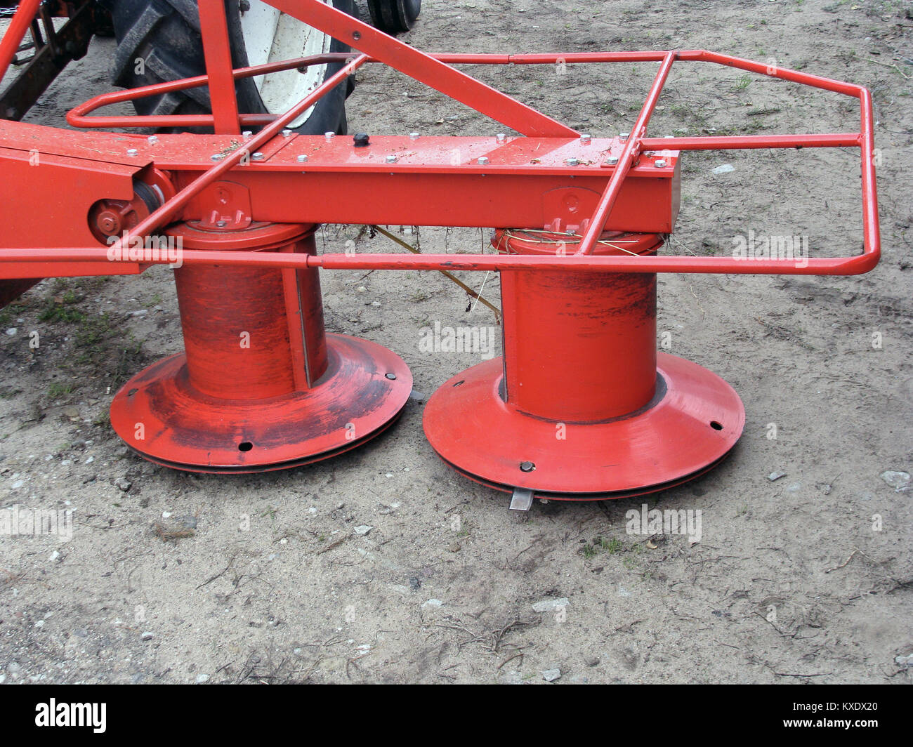 Red color tractor powered rotary mower with two rotors Stock Photo Alamy