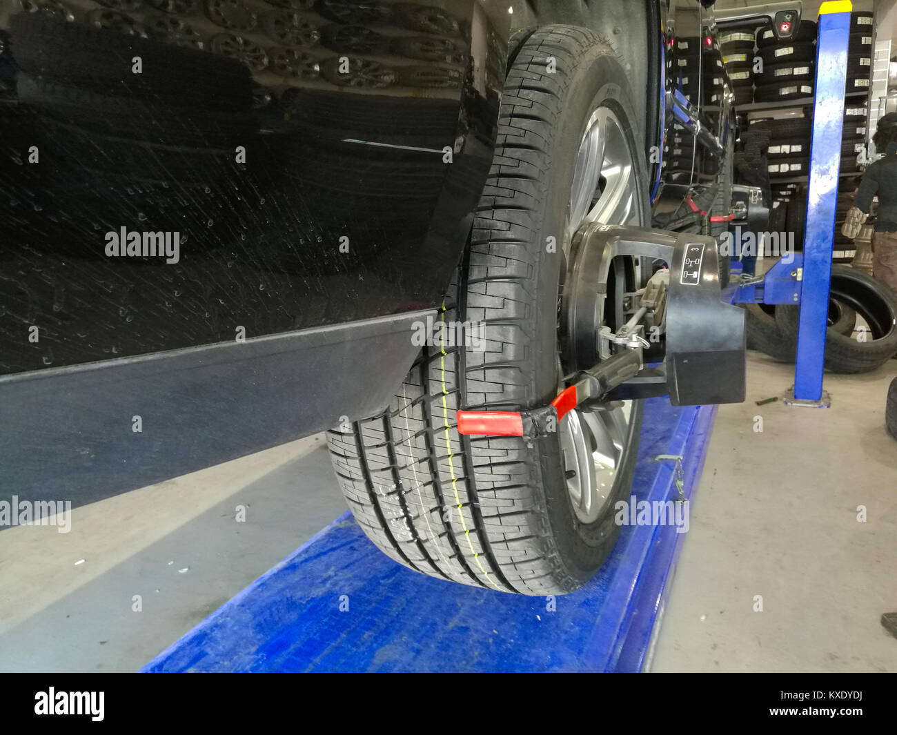 a vehicle is under wheel alignment process Stock Photo Alamy