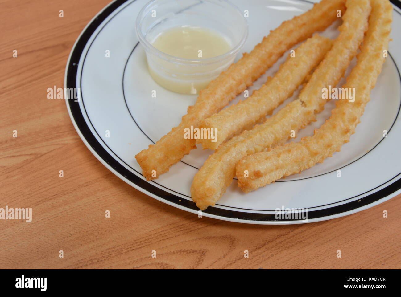 Churros Spanish deep fried dough stick Stock Photo Alamy