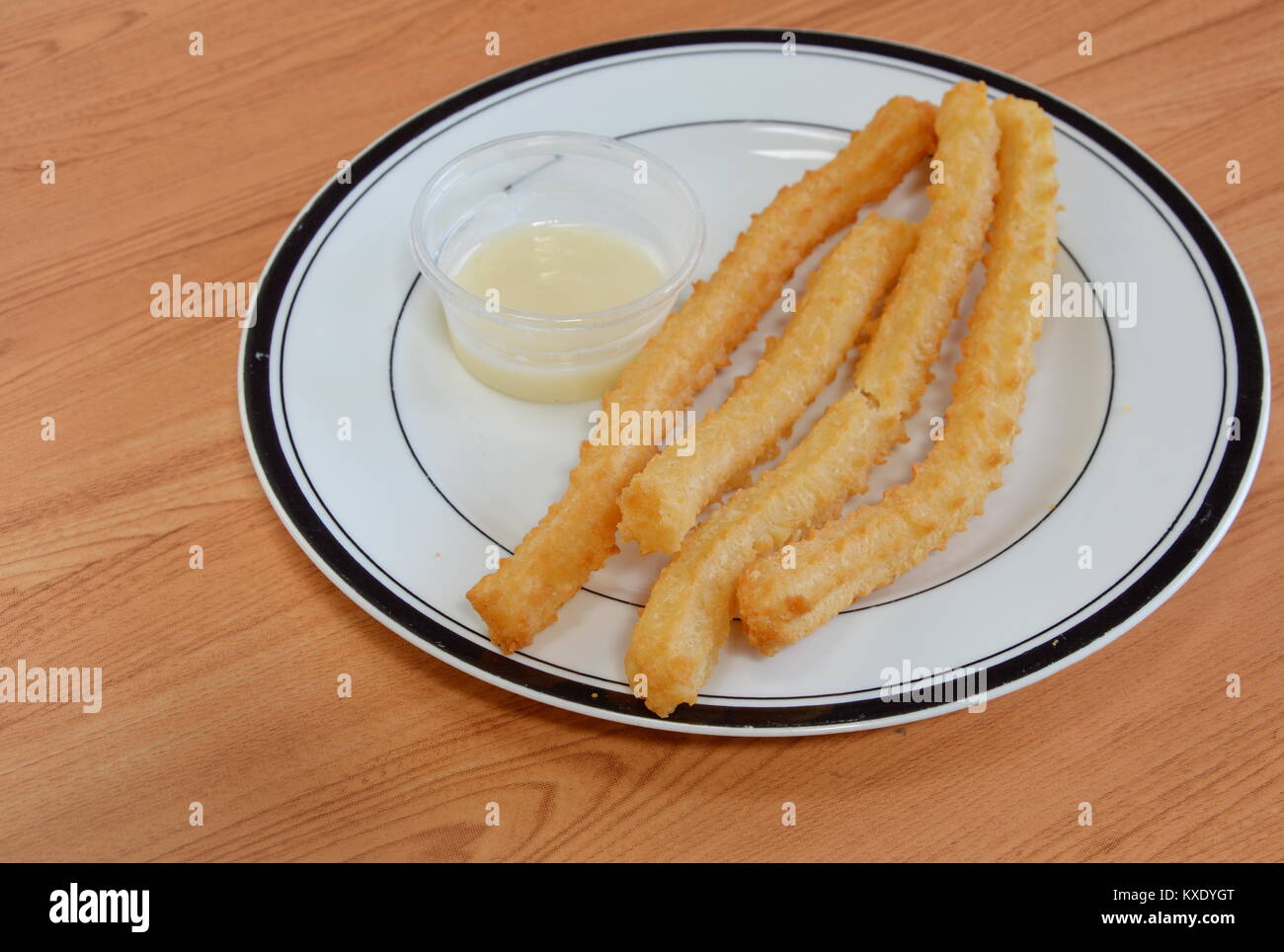 Churros Spanish deep fried dough stick Stock Photo Alamy