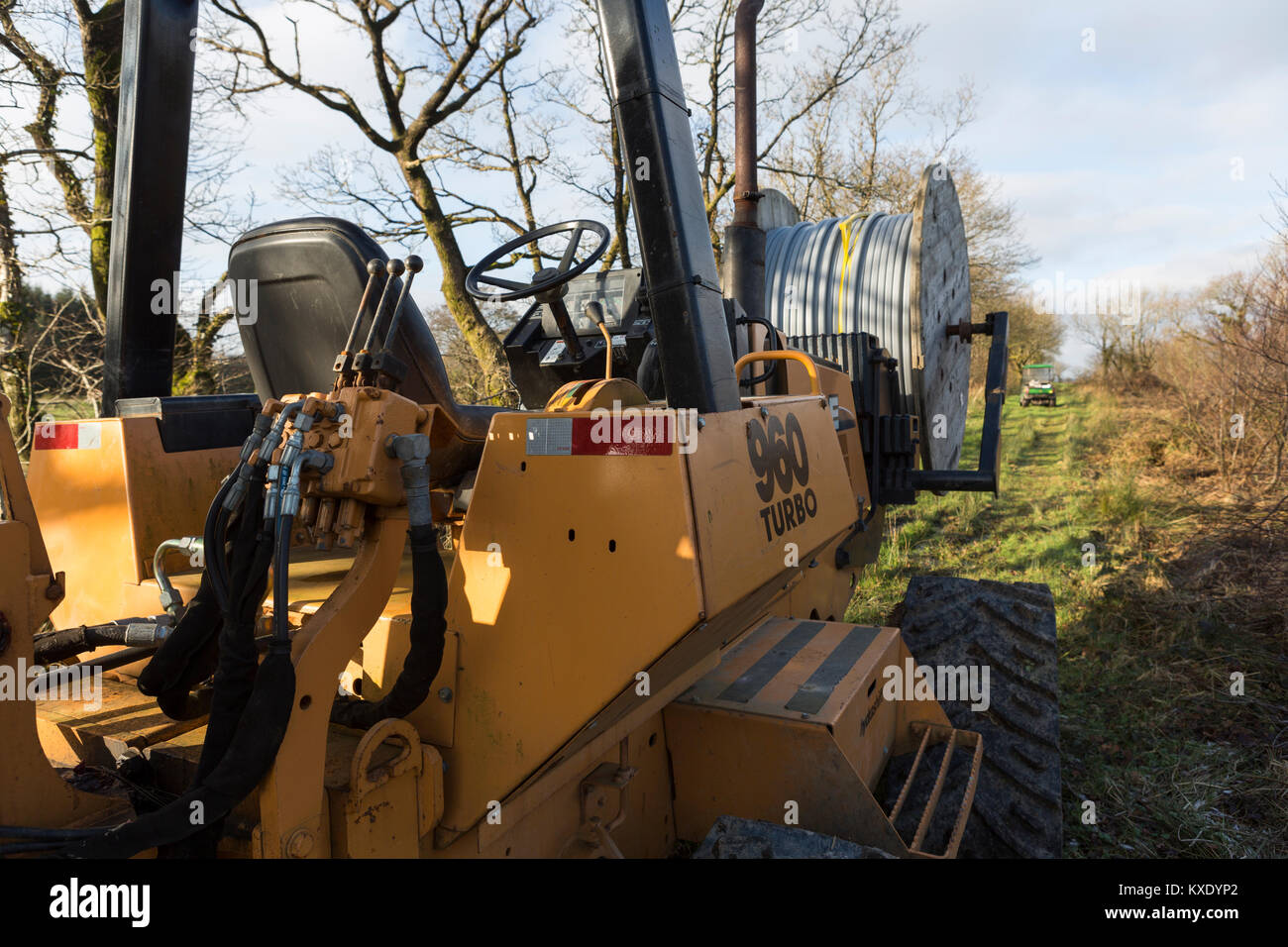 Case 960 Turbo cable laying trencher machine with spool of fibre-optic cable - rollout of broadband internet to rural communities Stock Photo