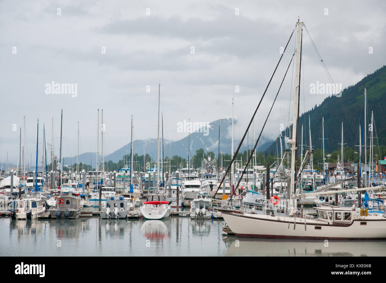Many boats anchored in the harbor in Whittier. Stock Photo