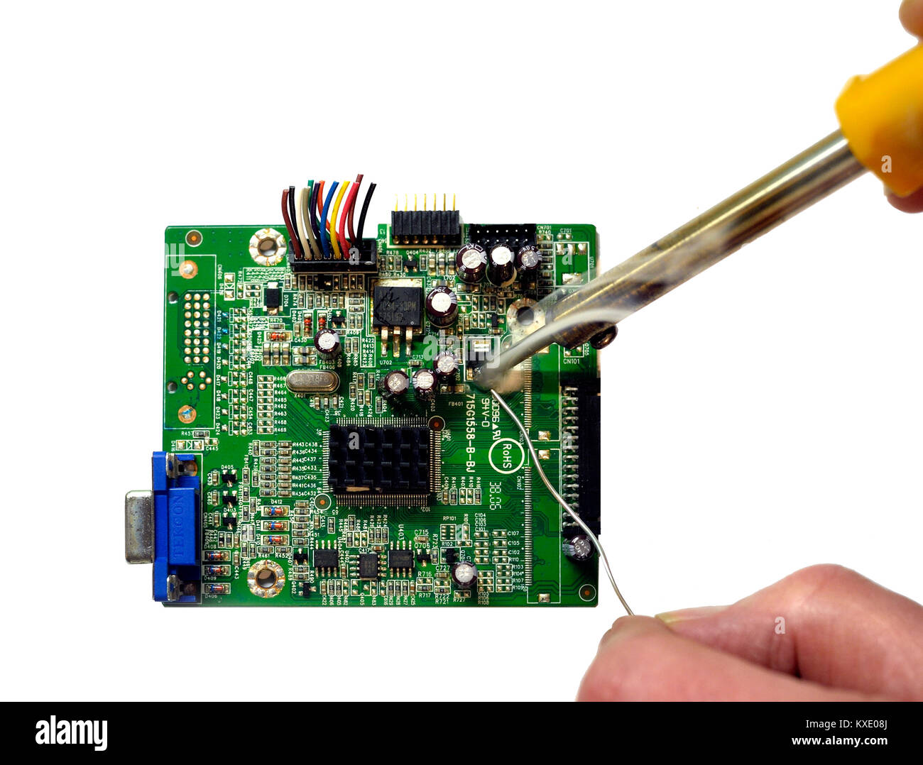 Soldering components on a circuit board Stock Photo