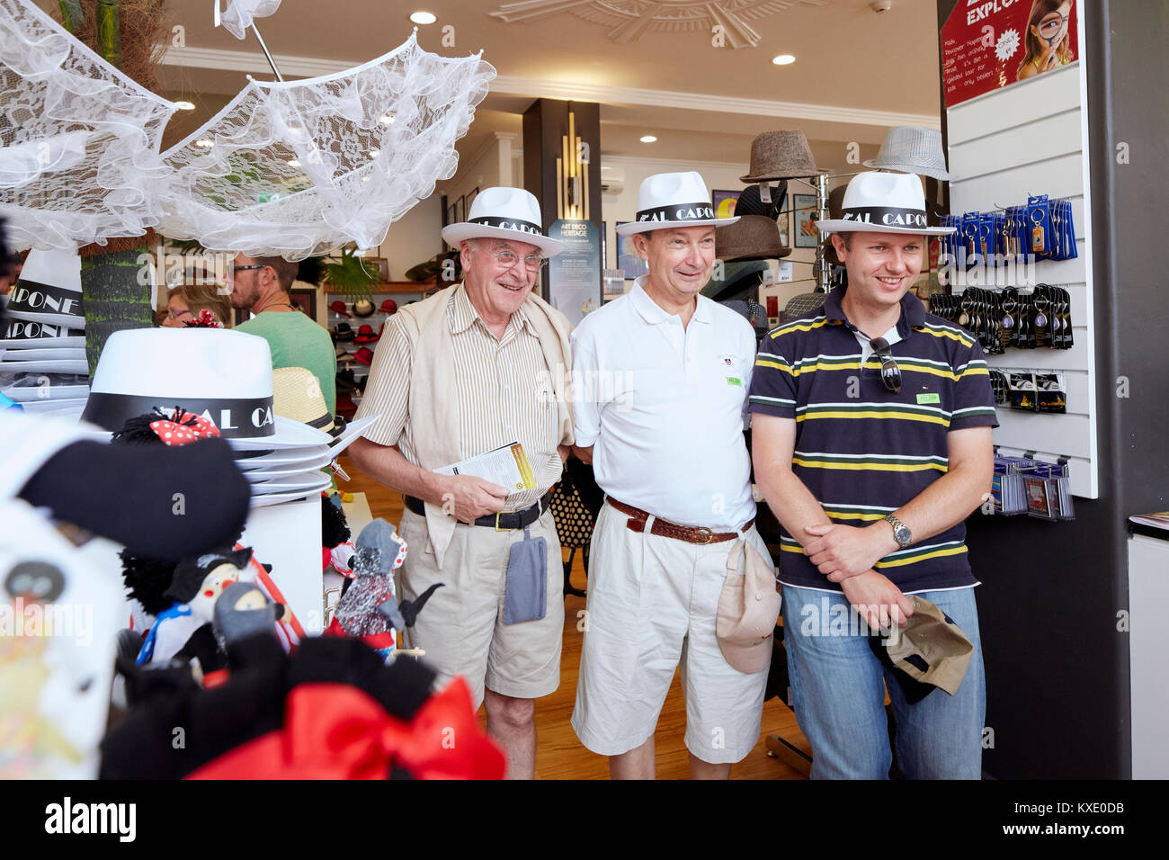 Three man at the Art Deco Centre souvenirs store with Al Capone hats, Hershell Street, Napier, New Zealand Stock Photo