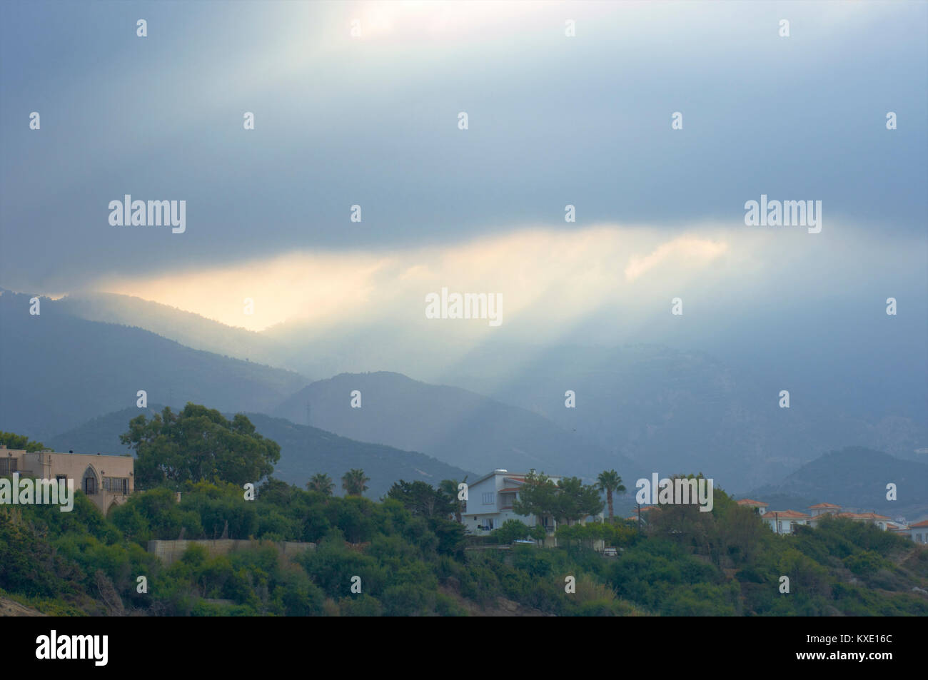 Dramatic scenery with sun beams coming through the clouds in Kyrenia, Cyprus Stock Photo