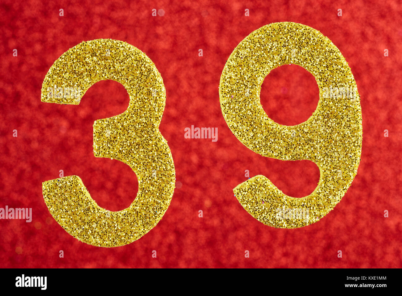 Number thirty-nine gold color over a red background. Anniversary. Horizontal Stock Photo