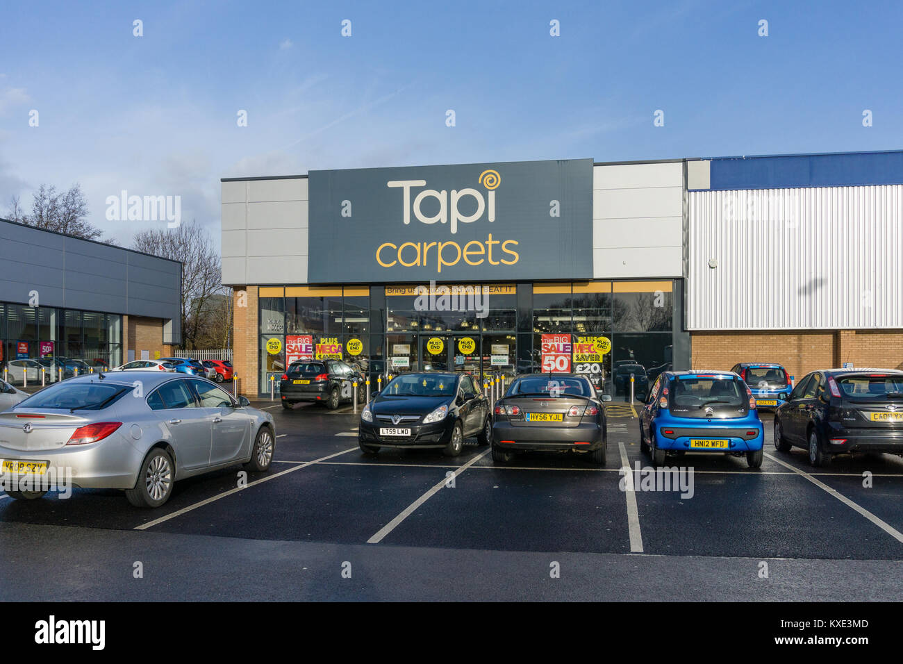 Shop front of Tapi Carpets, specialists in carpets, laminate and vinyl  flooring; Nene Valley Retail Park, Northampton, UK Stock Photo - Alamy