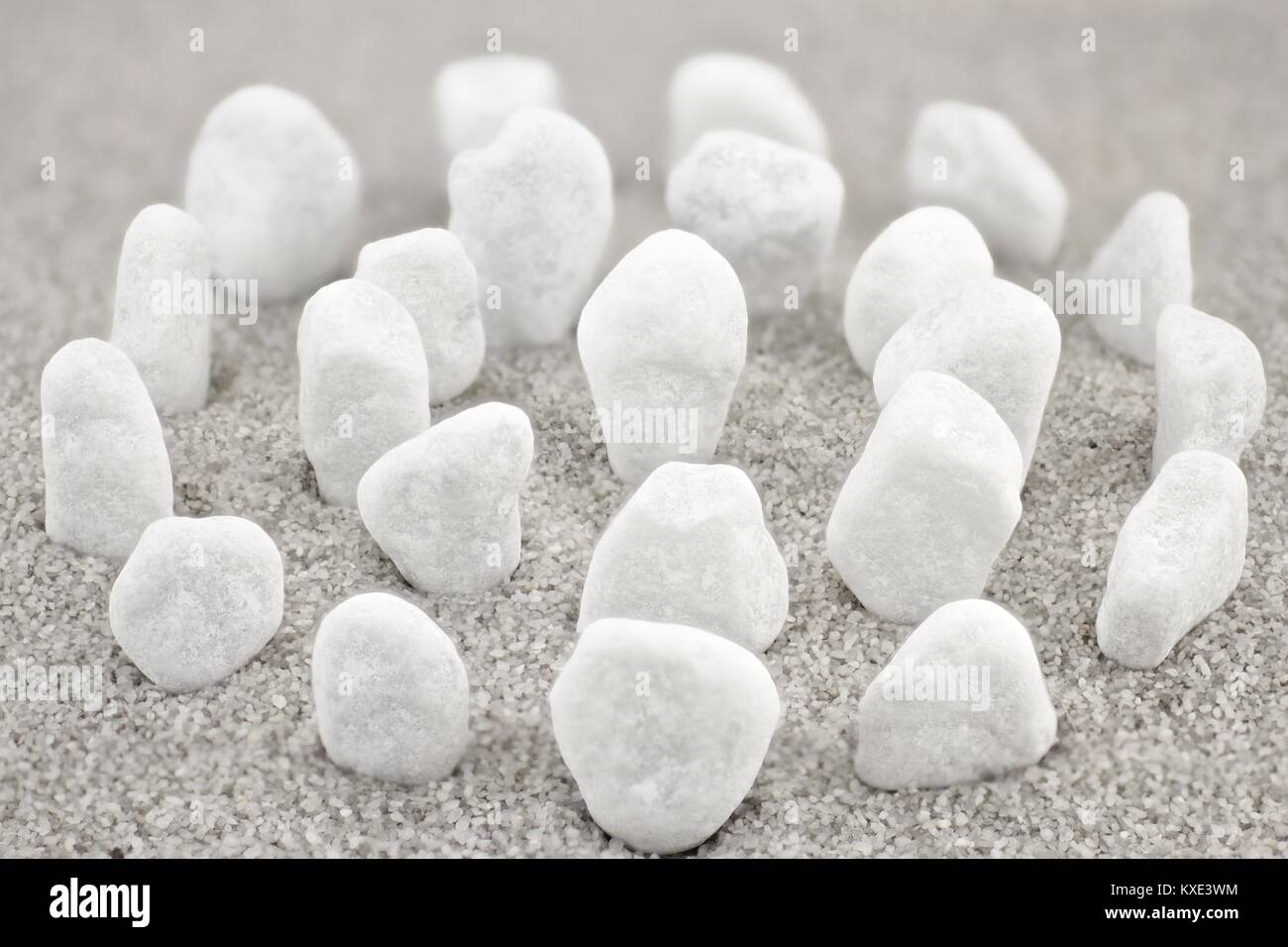 Standing white pebbles aligned in a circle Stock Photo