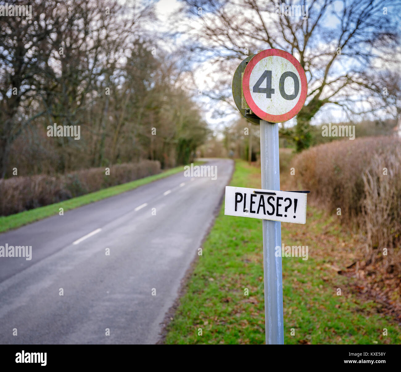 A local resident ad Please?! to a speed limit sign of 40 MPH outside ...