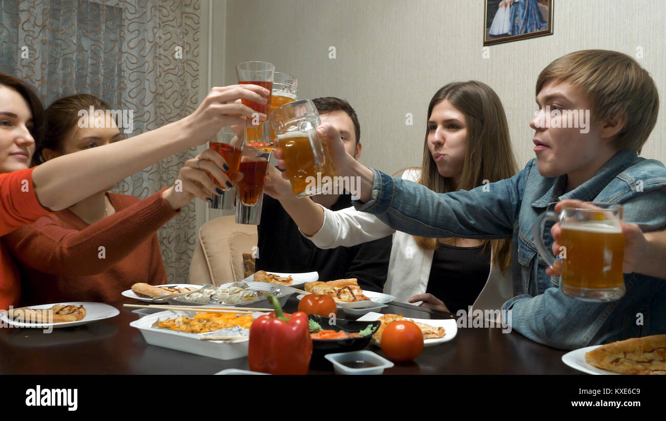 Friends eat and talk at a dinner party at home. Dinner with friends